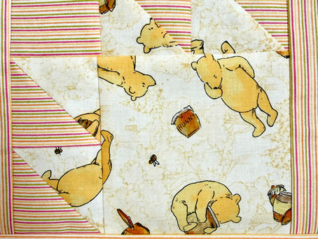 Winnie-the-Pooh Baby Quilt: A Bear Paw Tribute to 100 Years of Sweetness