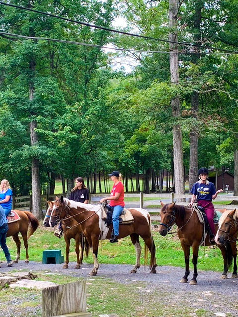 Ready for the ride - Scenic trail ride at Fort Valley Ranch & Campground winding through the picturesque trails of a National Park, surrounded by breathtaking mountain views near Shenandoah National Park.