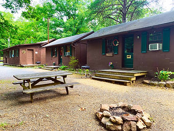 Rustic cabins nestled in the woods, offering a cozy retreat near Shenandoah National Park.