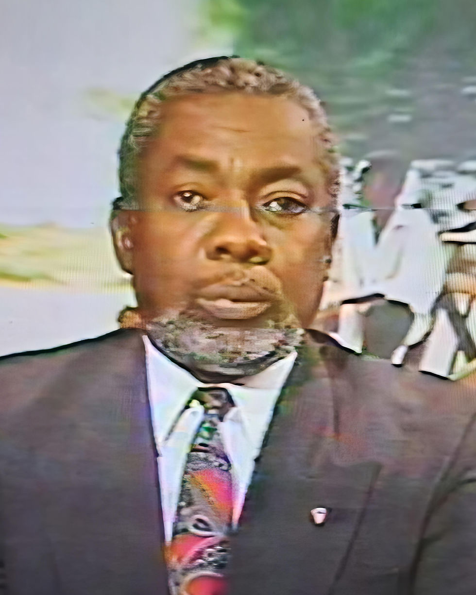 Upper body shot of Keith Brown dressed in a suit and colourful tie.