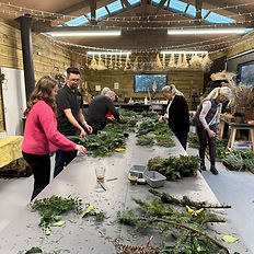 Workshop attendees creatimng their wreathes in the studio