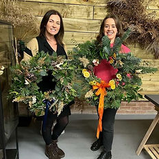 Two workshop attendees with their wreathes