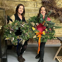 Two workshop attendees with their wreathes