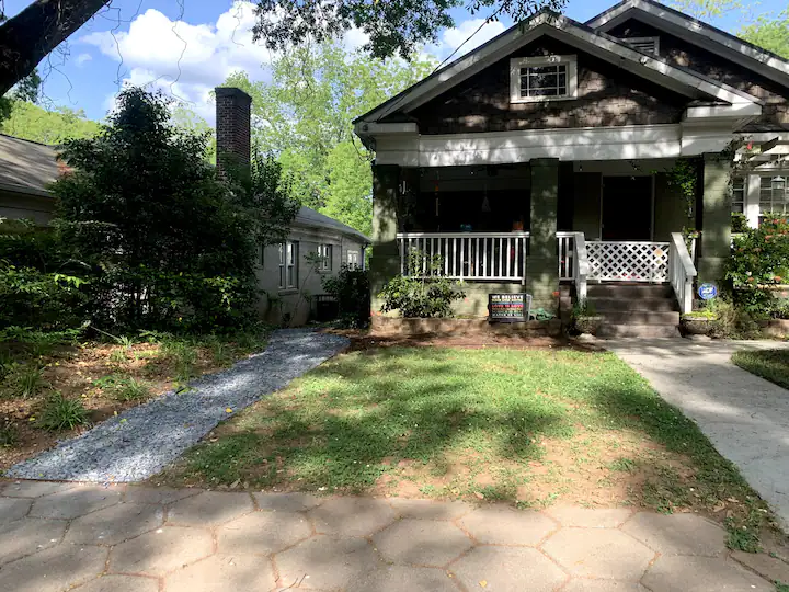 Small bungalow style home with lush front yard