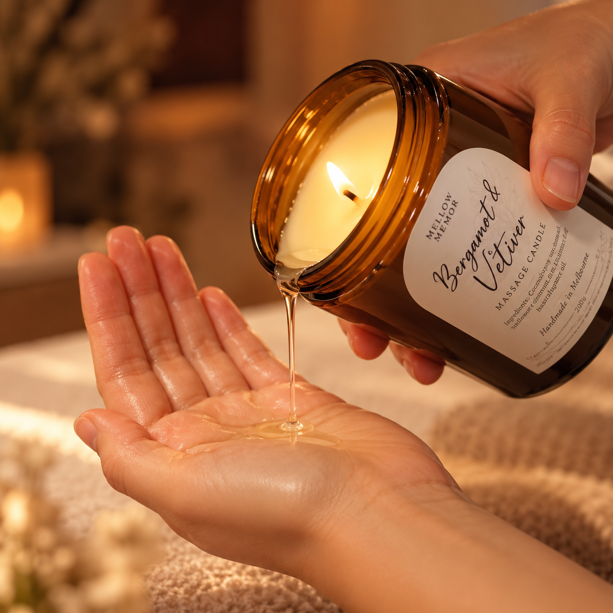 Bergamot and Vetiver massage candle pouring warm oil into a palm