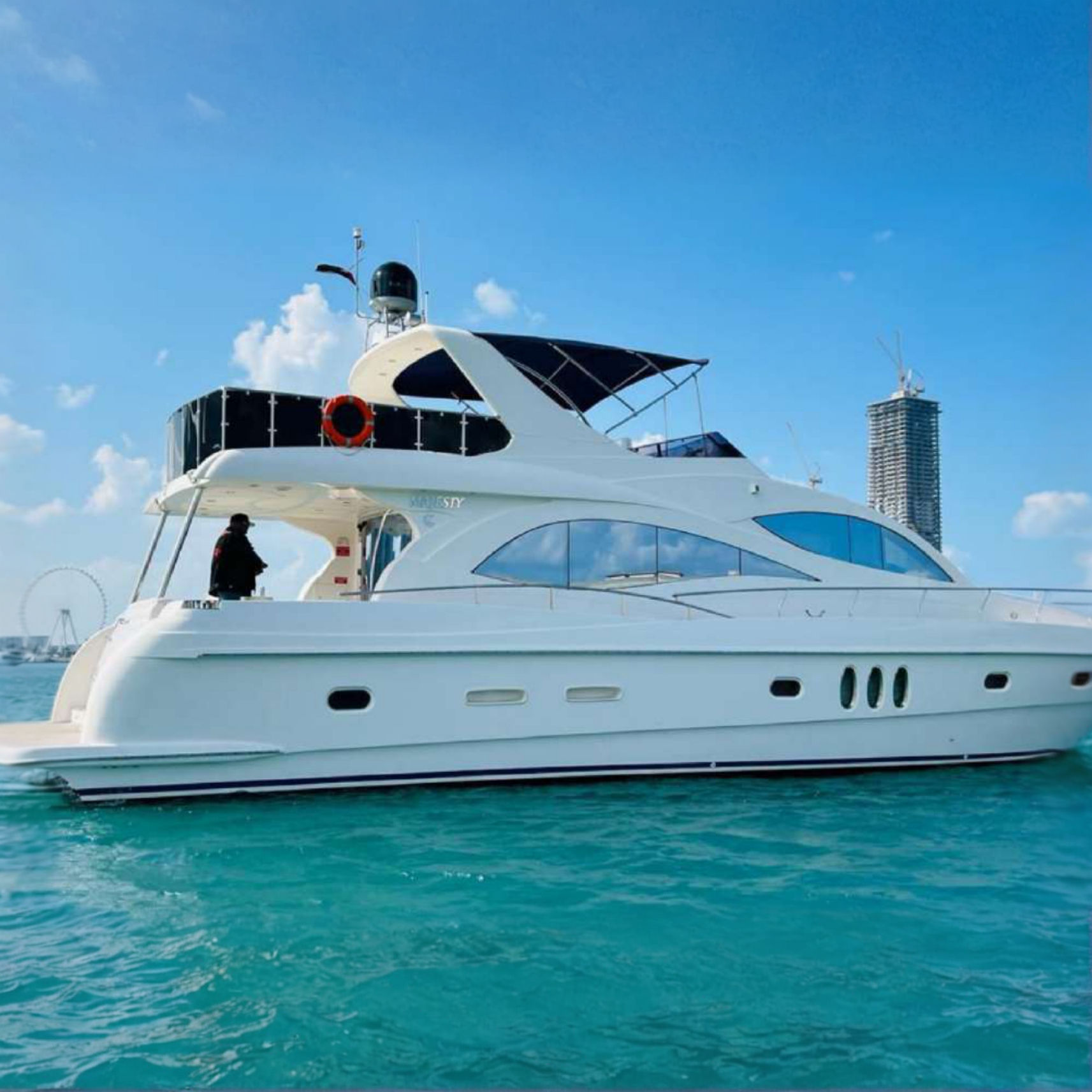 The Batman 70ft luxury yacht cruising on clear blue water