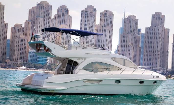 Majesty 44ft rental yacht docked at Dubai Marina with skyline view