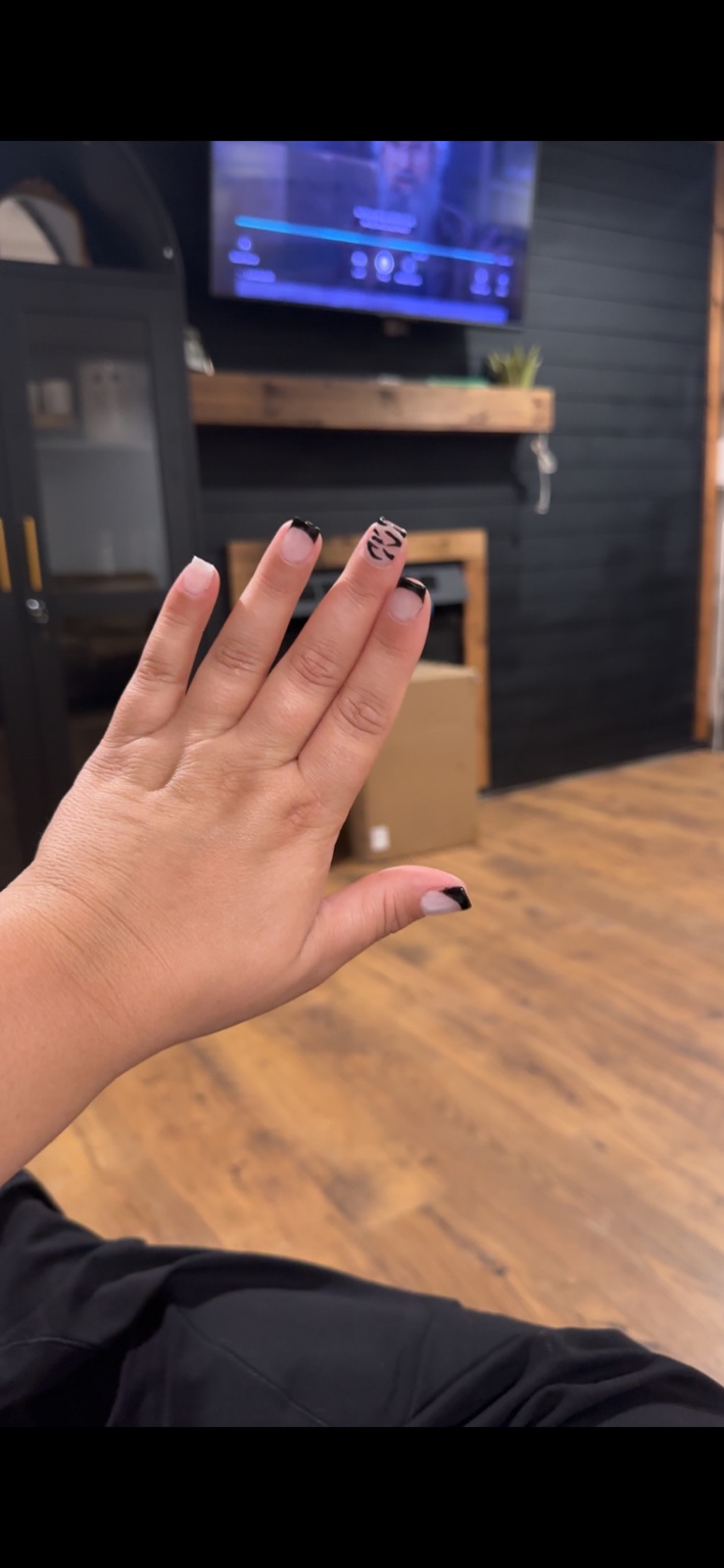 Black French tips with zebra accents by Chelsi Troxell