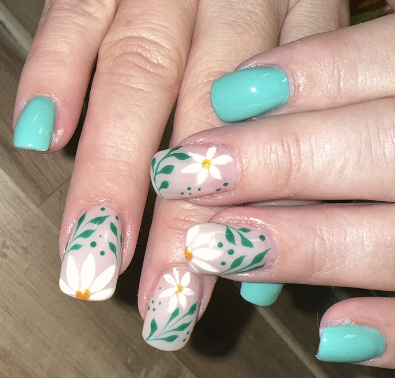 Turquoise nails with white daisies by Sherry Ball