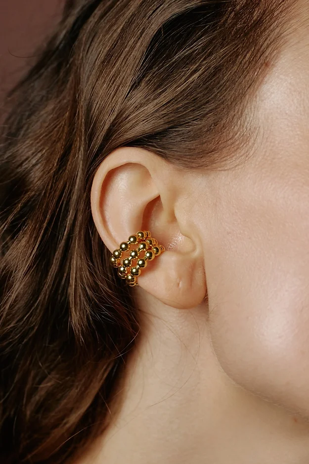 Gold cuffs on the ear