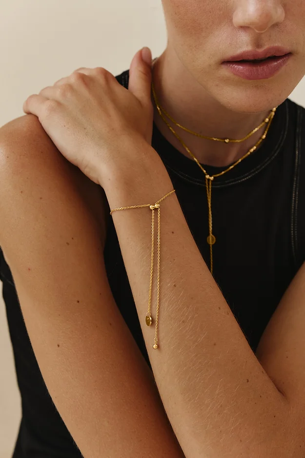 Gold bracelet with tails