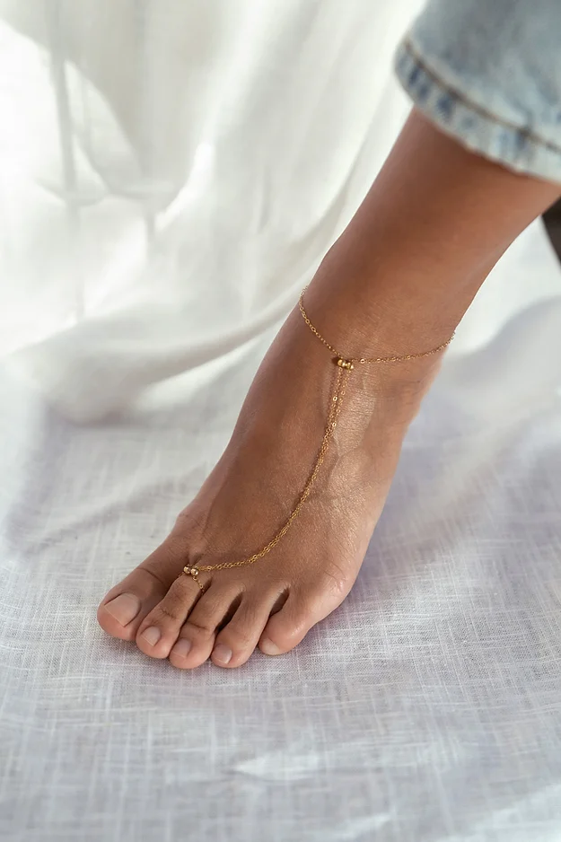 Gold anklet on the ankle