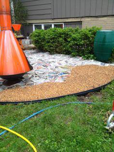 Cover w/ newspaper, then gravel