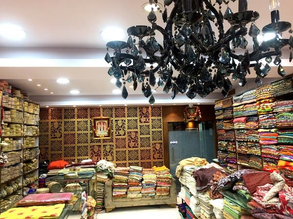 Fabric store in Kolkata, India with beautiful black chandelier.