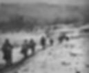 GIs of the 142nd IR marching through the snow-covered Les Rouges Eaux valley