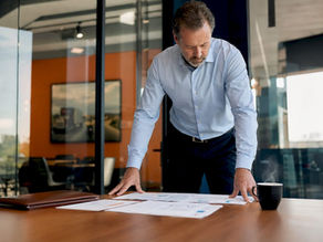 Broker reviewing trucking insurance policies