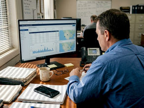 Fleet manager reviewing ELD compliance on computer