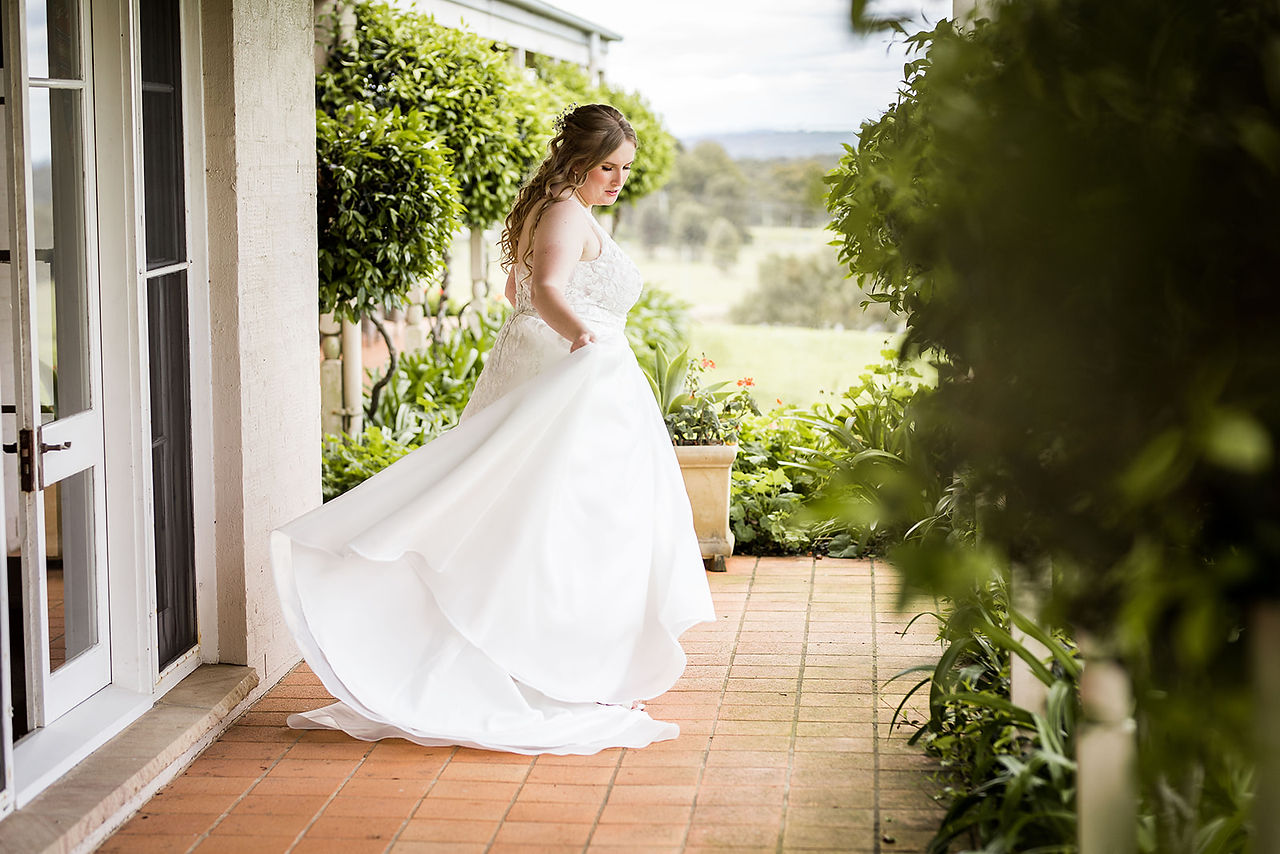 bride and her dress on a patio at holman estate