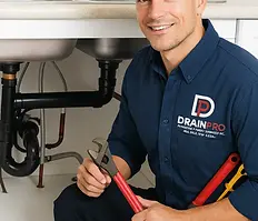 DrainPro licensed plumber providing leak detection and pipe repair under kitchen sink in Toronto GTA.