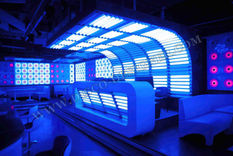 An immersive nightclub in Minsk, Belarus with red and black lights.