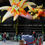 Thumbnail: Two giant orange custom inflatable flowers designed by Disco Designer Ltd.