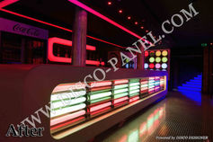 3D rendering of an interior design project for a night club bar with a modern futuristic style featuring neon lights and blue LED lighting behind the bar counter with the theme "DJ virtual digital projector".