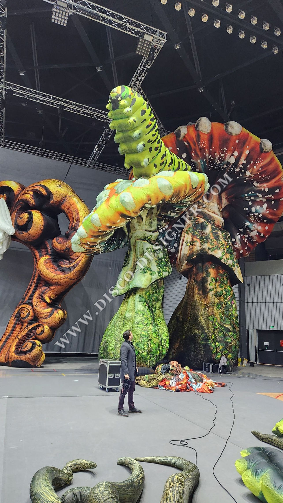 Thumbnail: Giant caterpillar on a custom inflatable mushroom designed by Disco Designer Ltd. from an AI concept.