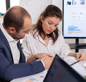 colleagues-startup-business-discussing-looking-documents-company-board-brainstorming-confe