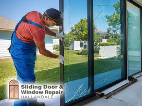 cracked sliding glass door panel, technician removing glass, Florida home exterior