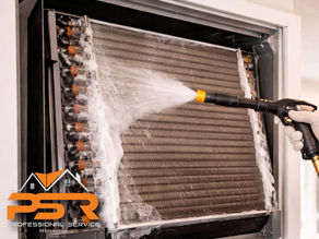 technician cleaning AC evaporator coil with specialized tools
