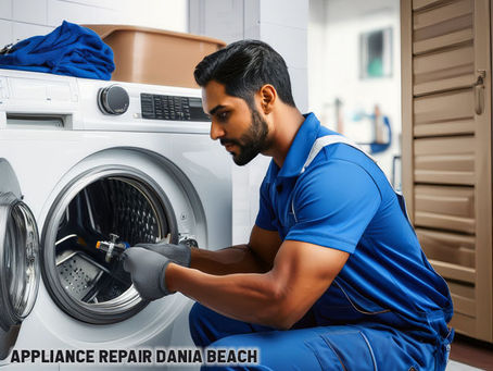 Technician working on a washing machine drum, with tools and replacement parts nearby in a clean laundry room