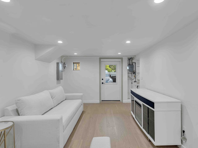 completed remodel of ADU home addition featuring living area new flooring paint lighting