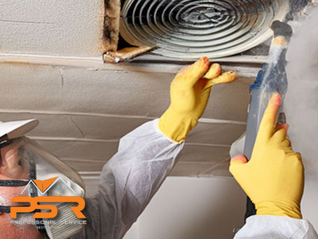 professional service technician working inspecting cleaning ceiling air ducts