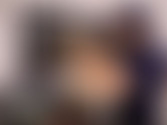 repair technician repairing an over-the-range microwave in a modern kitchen