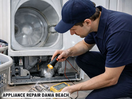 Technician checking a dryer’s heating element with laundry baskets nearby, showing lint buildup and tools on the floor for dryer repair