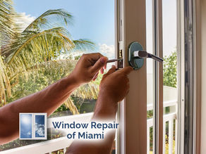 close-up of technician tightening sliding window lock mechanism hardware repair in a modern home in Miami