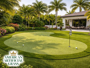 A stunning backyard in Port Saint Lucie featuring a custom synthetic turf putting green with curves, fringe turf, and palm trees