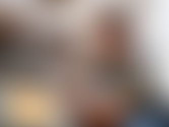 home repairs Technician inspecting a small plumbing leak under a bathroom sink in a modern residence