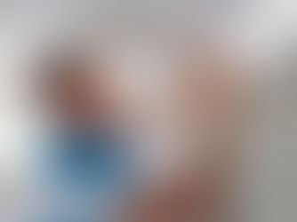 home repairs Technician repairing a small drywall crack in a bright Broward County living room