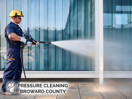 professional technician worker at commercial building pressure. cleaning broward county florida