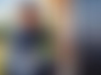 technician changing the internal pins of a lock on a residential front door, with tools neatly arranged beside them re-key vs replace