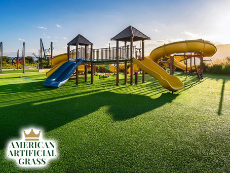 artificial synthetic turf grass for safe and durable playground showing swings and slides