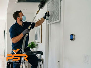 professional HVAC sanitizing by technician for duct system, clean modern home interior