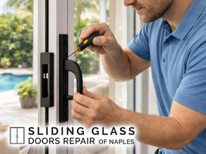 close-up of repair technician replacing lock and handle hardware on a sliding glass door in a Naples home