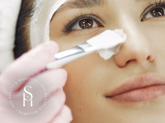 ISHA Beauty & Wellness technician applying cream for youthful eyes skin