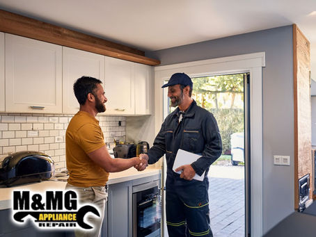 Professional Appliance Repair Technician shaking hands with satisfied customer standing in residential kitchen broward county florida