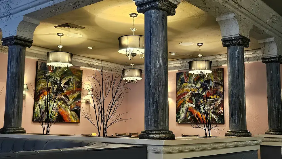 Bird cage dining area at Tropics Grille, an intimate enclosed space with a few tables for private dining