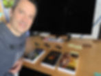 Nicolas Lemieux, Science Fiction Author, displaying my, er, his printed copies of The Starlight Chronicles trilogy by D. L. Lewellyn