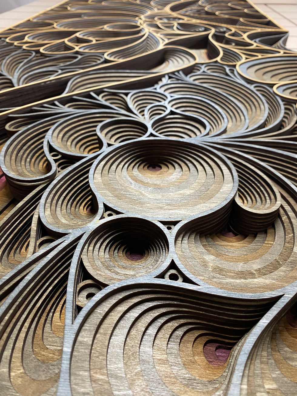Thumbnail: A close up view of the Luna sculpture, showing layering and design features. 