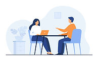 Image de personnes assises face à face autour d'une table